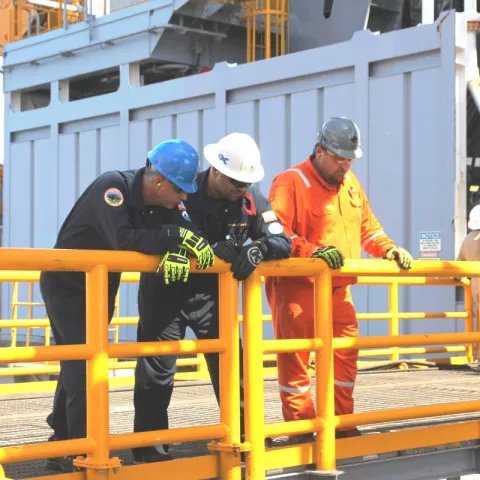 BSEE inspector points out to Director Angelle the components of the redundant subsea  blowout preventer ready on board the Diamond Offshore Ocean BlackLion.
