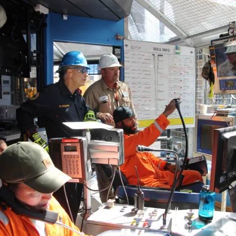 BSEE Director Angelle observing in the drill shack on board the Diamond Offshore  BlackLion drillship as the driller explaining the testing of safety devices.