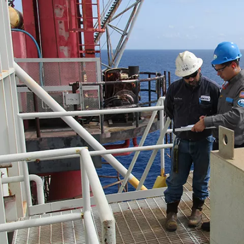 A BSEE Inspector discusses the fired vessel risk-based inspection with an Gulf of Mexico operator July 18, 2018.