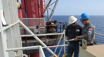 A BSEE Inspector discusses the fired vessel risk-based inspection with an Gulf of Mexico operator July 18, 2018.